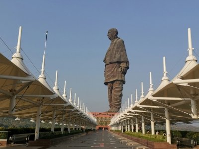 Statue of Unity monument with long covered walkway under a clear sky